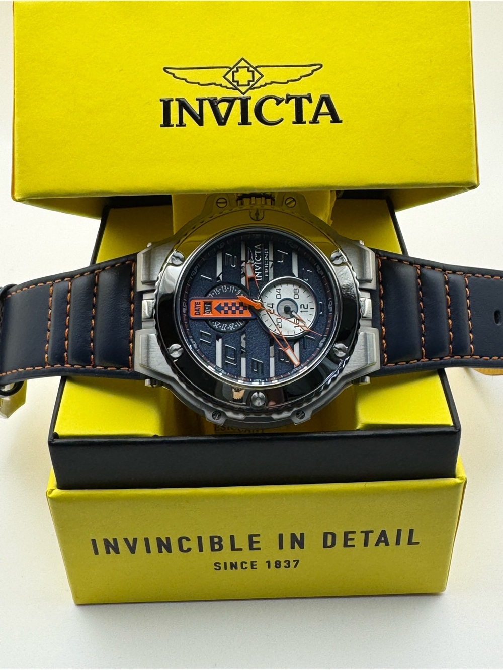 Invicta Black and Orange Accent Men's Watch with Stainless Bezel